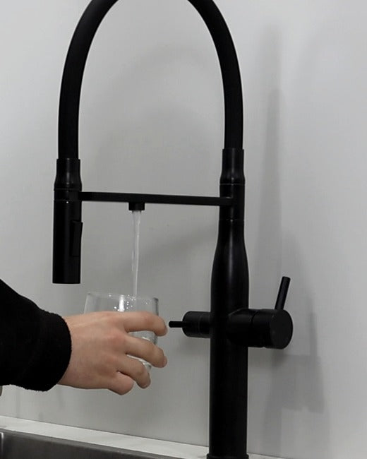 A 3-way mixer tap filling a glass.
