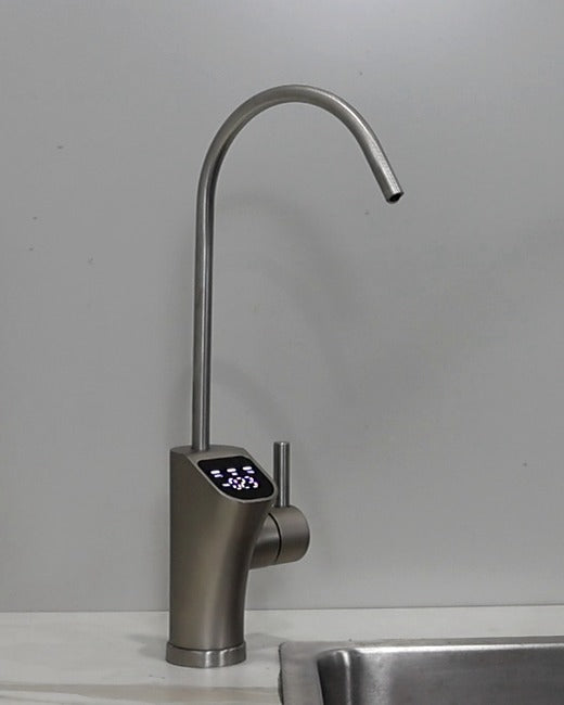 The filtered-water tap that comes in the box.