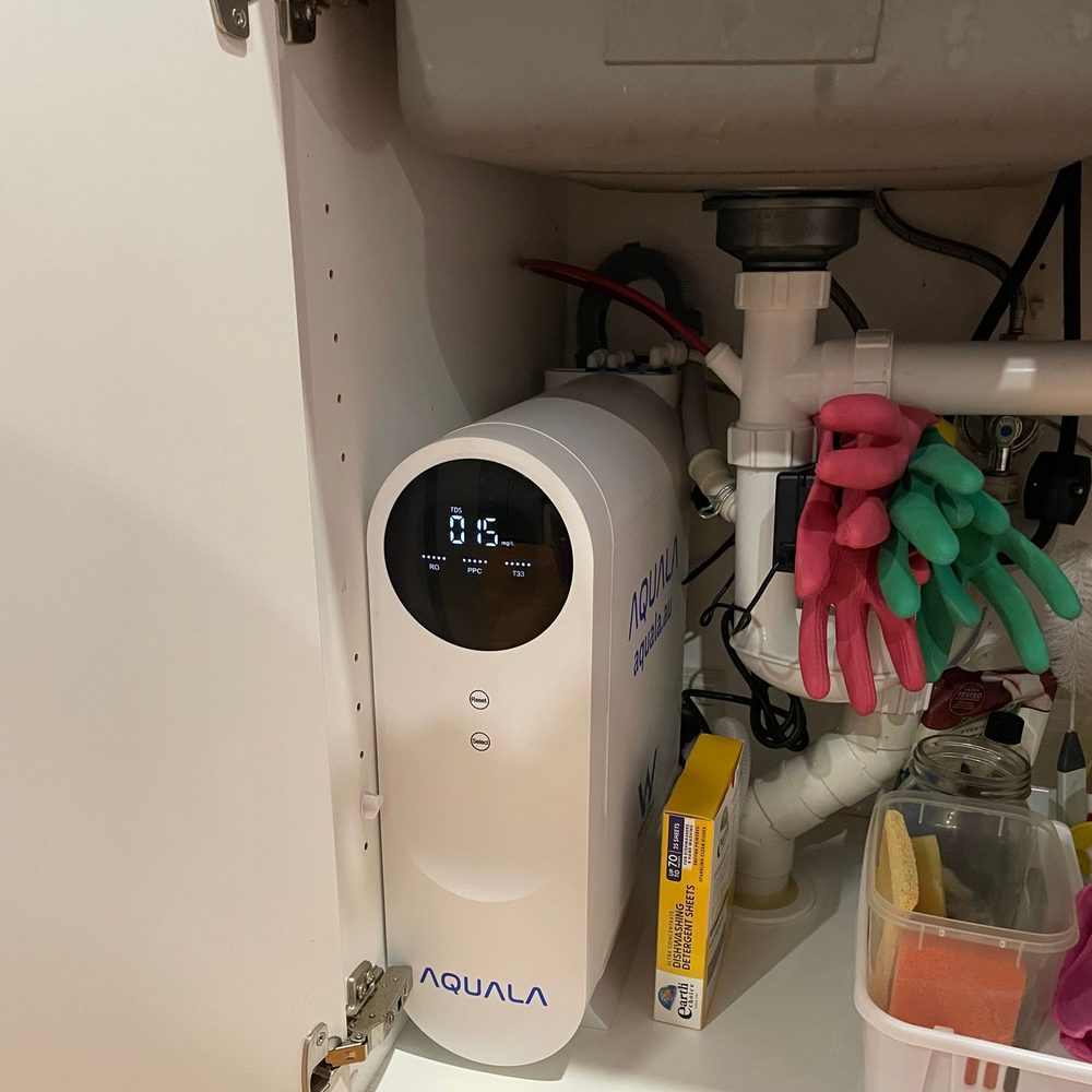 A customer's P500 standing in an under-sink cupboard.